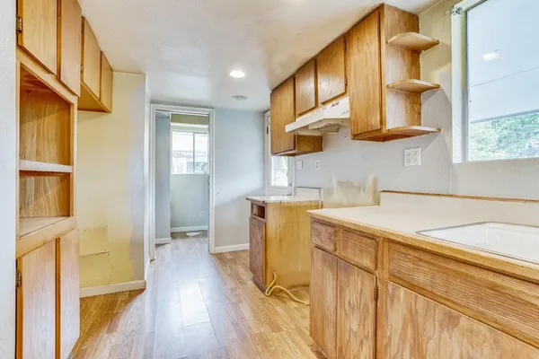a bathroom with a sink a mirror and a shower
