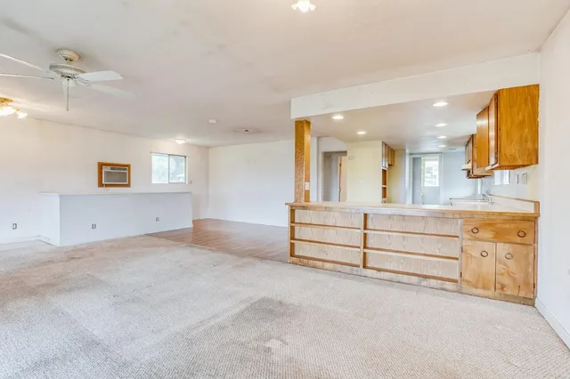 a view of a bathroom with sink and mirror