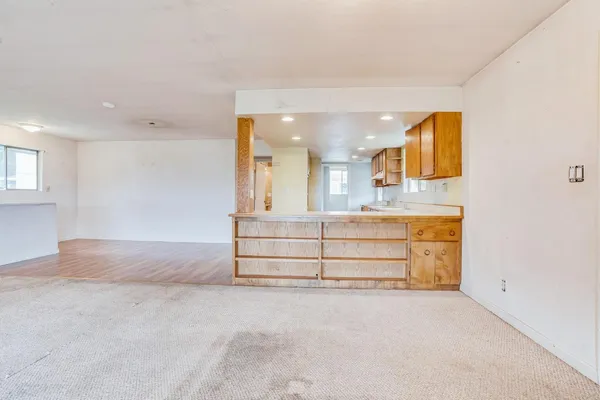 a view of a room with cabinets and couch
