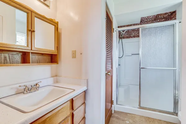 a bathroom with a sink and a mirror