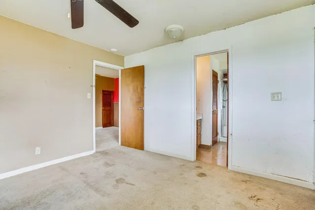 a view of an empty room and window