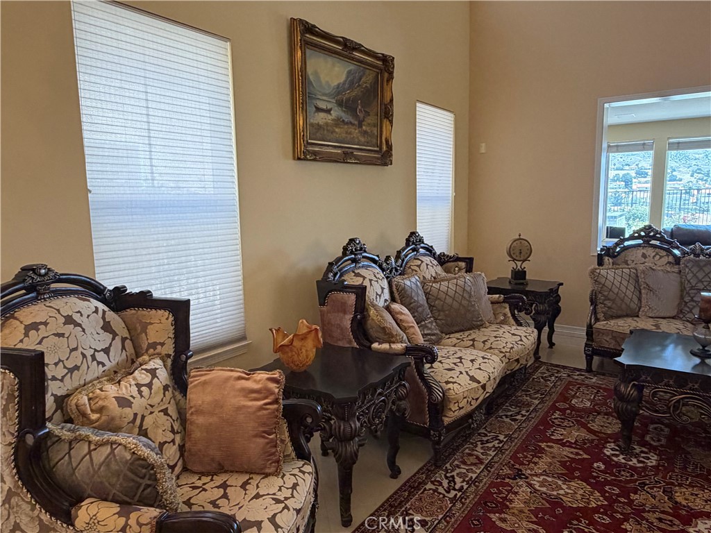 19823 Mariposa Pines Way Porter Ranch, CA 91326 - Photo 20 of 50 a bedroom with furniture and a window
