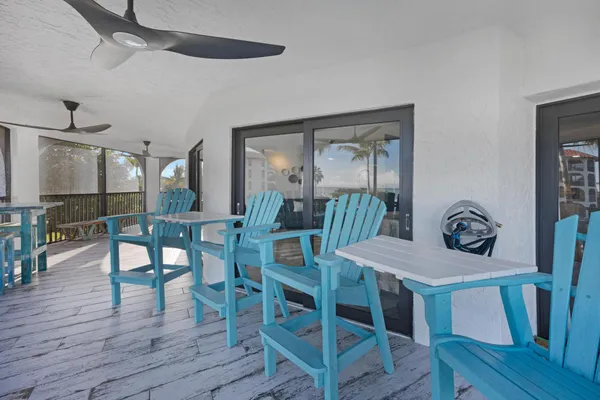 a front view of multi story residential apartment building with yard and sign board