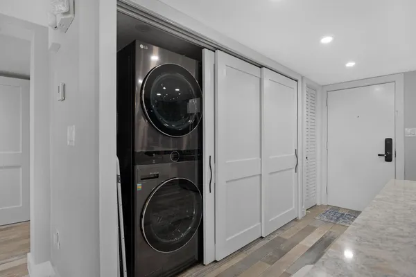 a view of a livingroom with furniture window and wooden floor