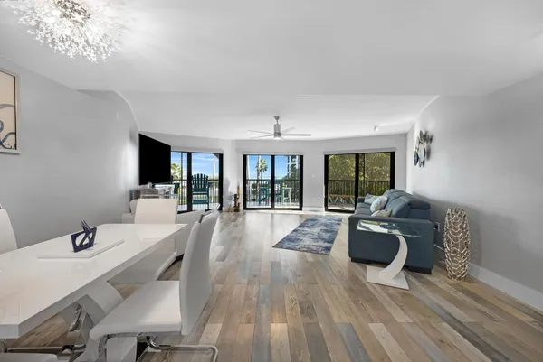 a view of livingroom with furniture wooden floor and chandelier