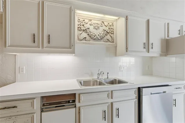 a kitchen with a sink cabinets and window
