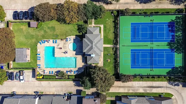 aerial view of a house and yard with green space
