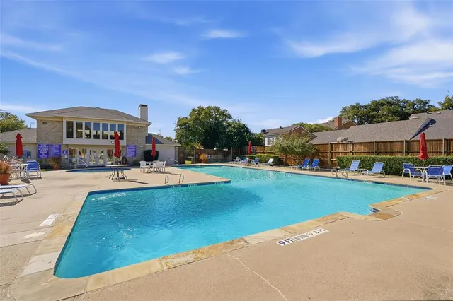 a view of street with houses and trees in the background