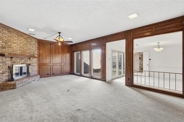 a view of an empty room with a fireplace