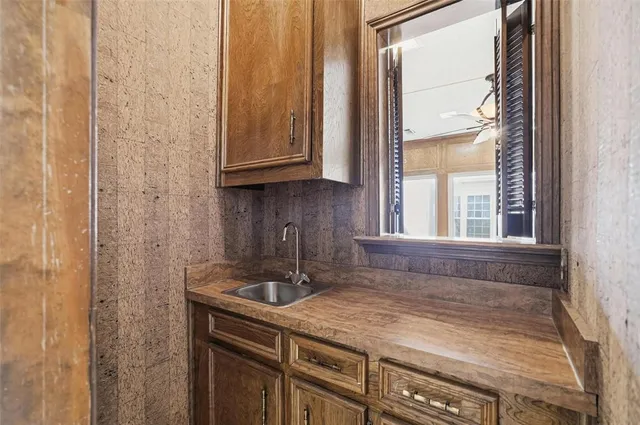 a bathroom with a sink and a window