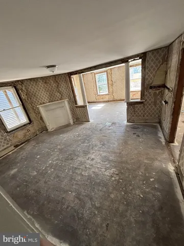 a view of room with window and stairs