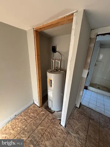 a view of a storage & utility room with a sink