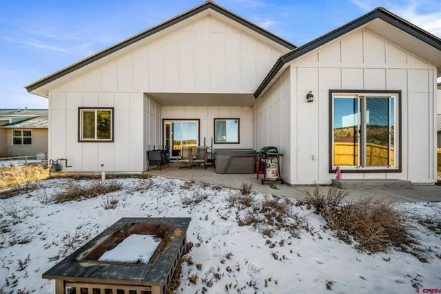 a front view of a house with backyard