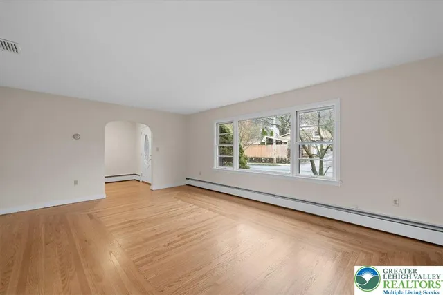 a bathroom with a tub sink and a mirror
