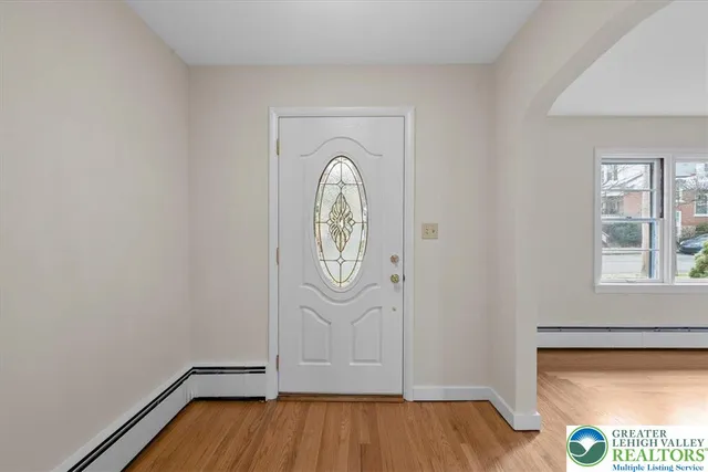 a view of front door with wooden floor