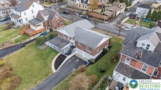 an aerial view of a house with a garden