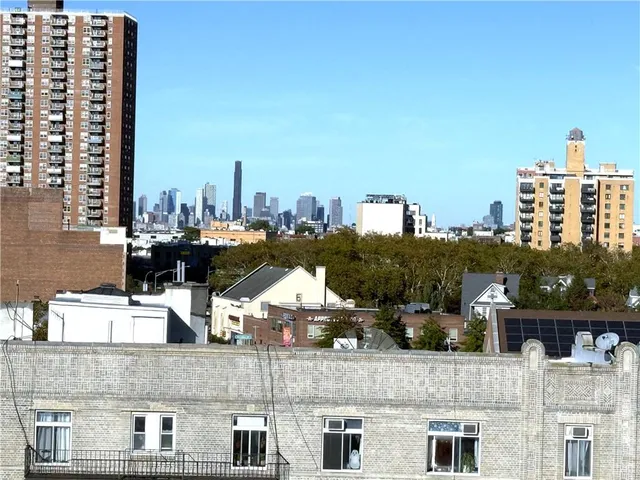 a picture of a bench in front of a wall