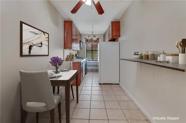 a kitchen with stainless steel appliances kitchen island granite countertop a sink and cabinets