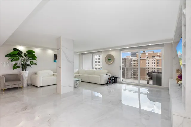 a bedroom with furniture and a large window