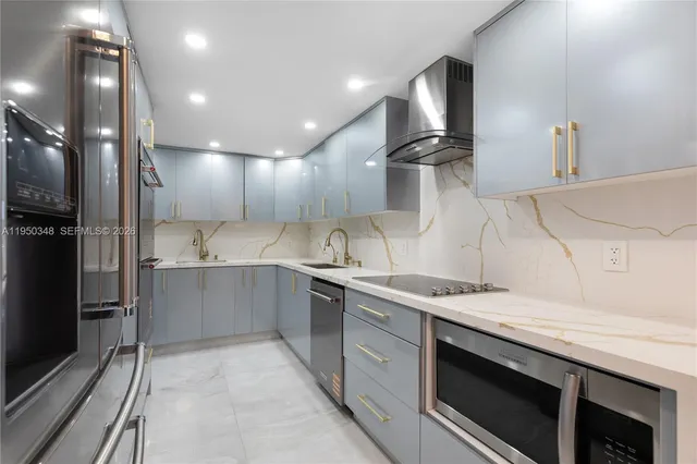 a kitchen with a sink stainless steel appliances and cabinets
