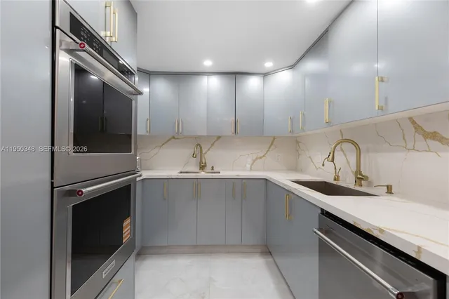 a kitchen with a sink and cabinets