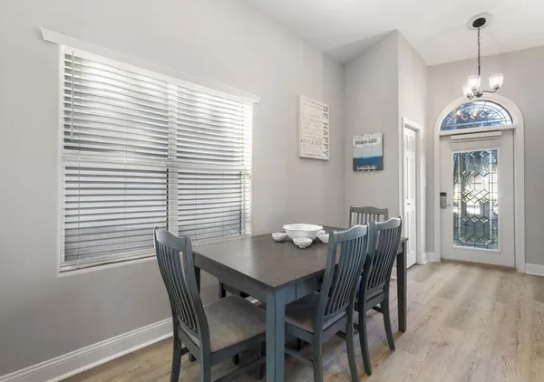a dining room with furniture and window