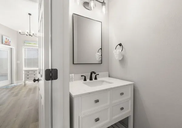 a bathroom with a sink and a mirror