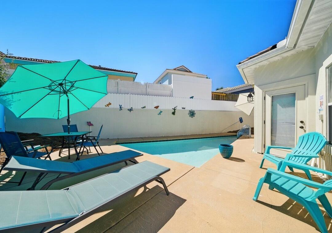 108 Terra Cotta Way Destin, FL 32541 - Photo 3 of 42 a view of an chairs and table in the patio