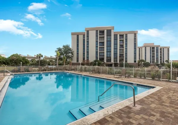 a view of a swimming pool with a patio