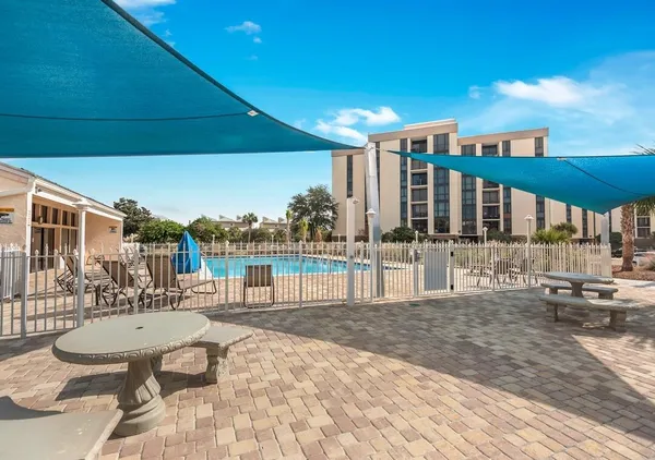a view of a patio with swimming pool