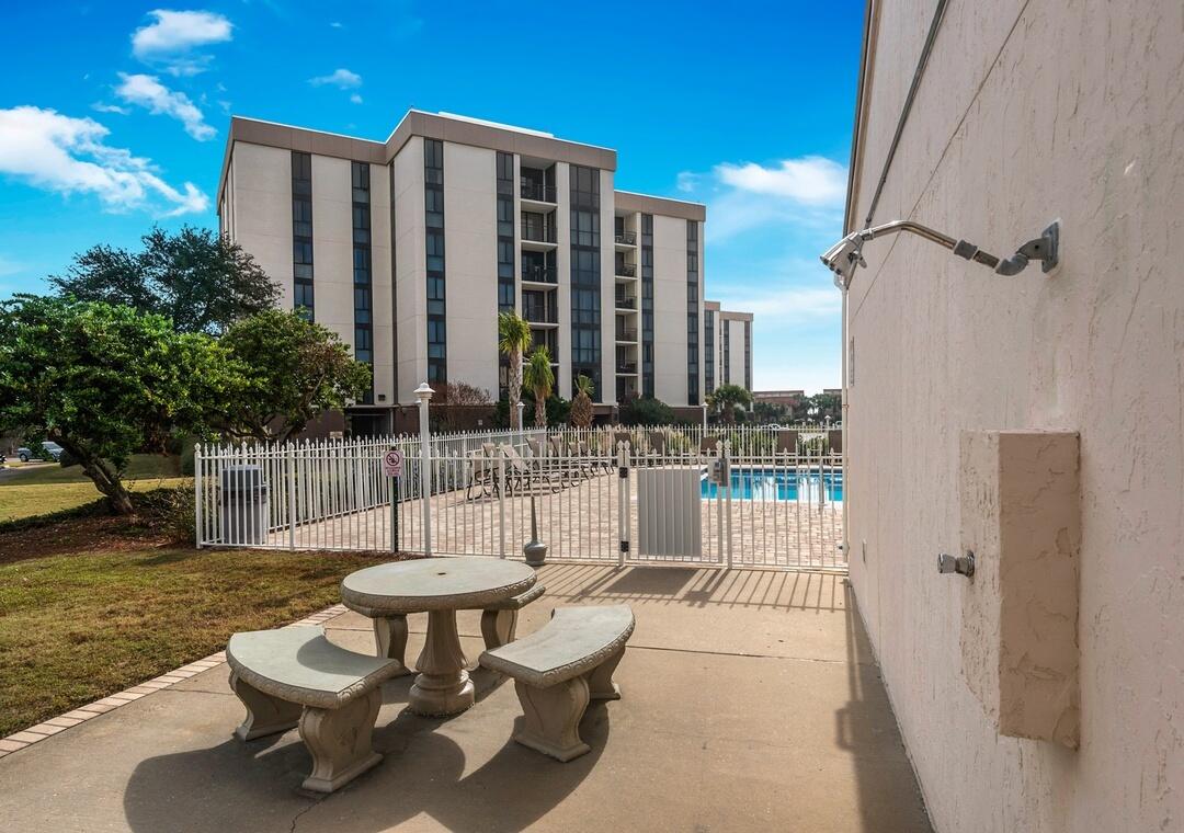 108 Terra Cotta Way Destin, FL 32541 - Photo 34 of 42 a view of a chairs and tables in the patio
