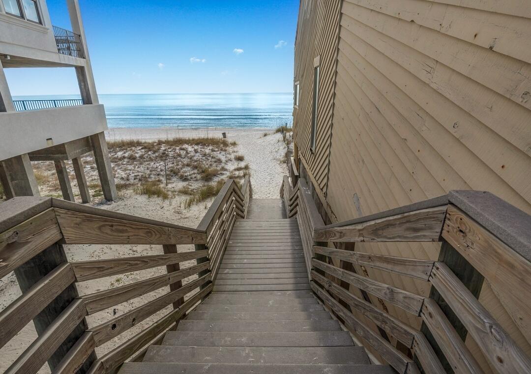 108 Terra Cotta Way Destin, FL 32541 - Photo 4 of 42 a view of an empty room with wooden floor and stairs