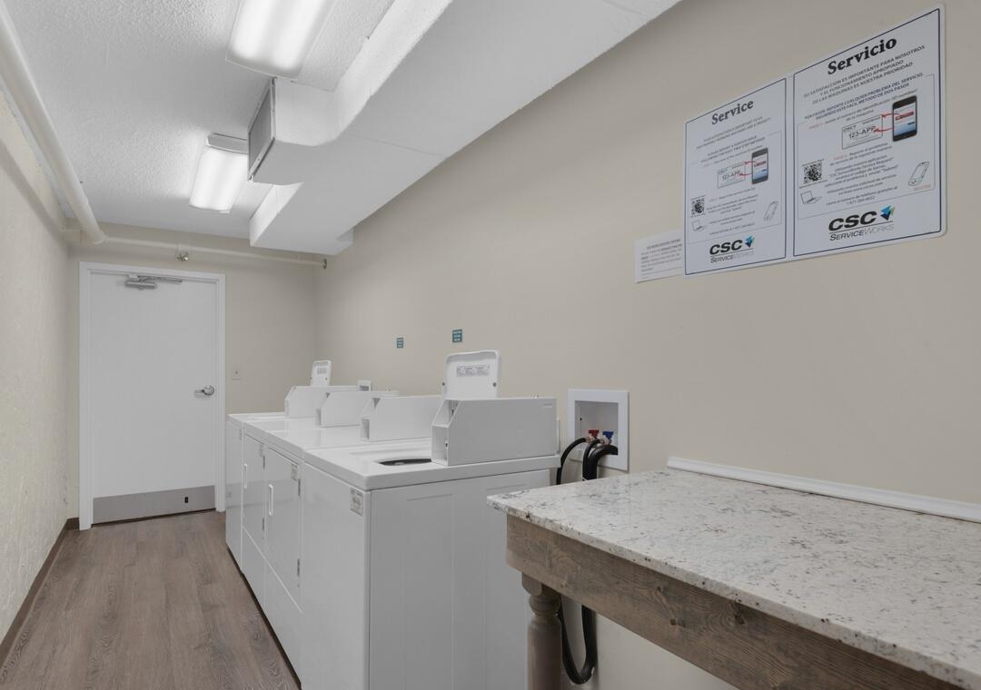 108 Terra Cotta Way Destin, FL 32541 - Photo 41 of 42 a utility room with a sink a cabinetry and appliances