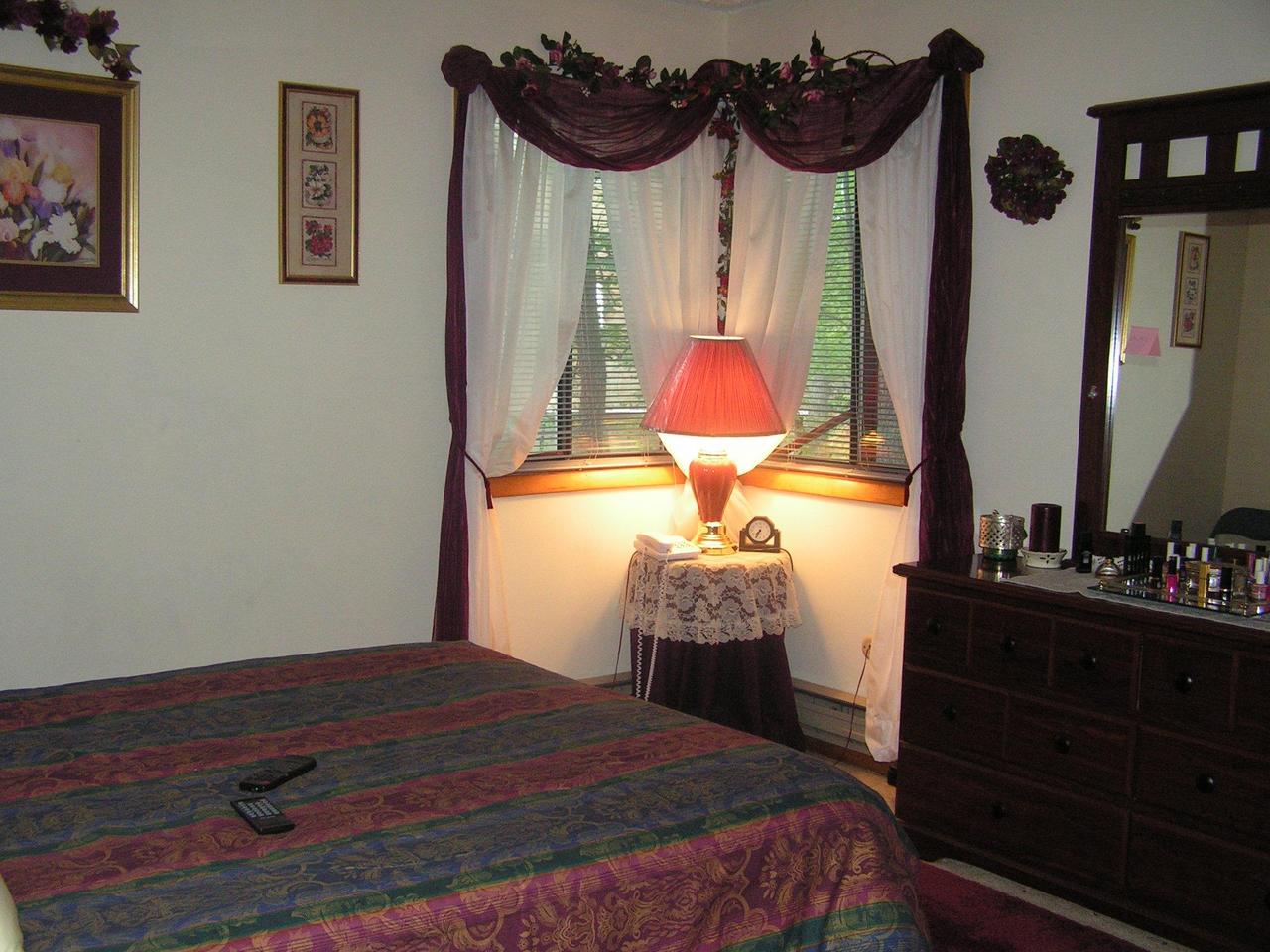 1038-15 Decker Road Arcadia, LA 71001 - Photo 11 of 19 a bedroom with a bed and a dresser