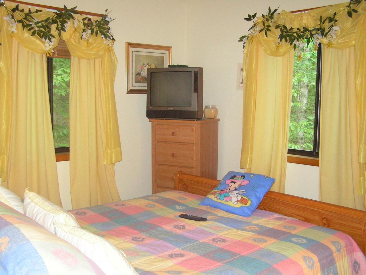 1038-15 Decker Road Arcadia, LA 71001 - Photo 15 of 19 a bedroom with a bed and wooden floor