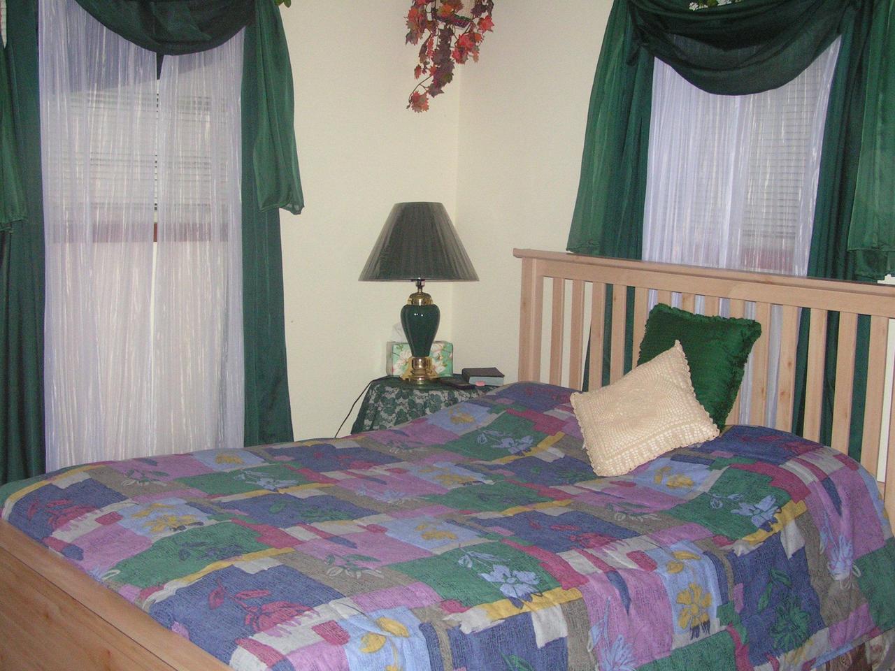 1038-15 Decker Road Arcadia, LA 71001 - Photo 16 of 19 a bedroom with a bed and a window
