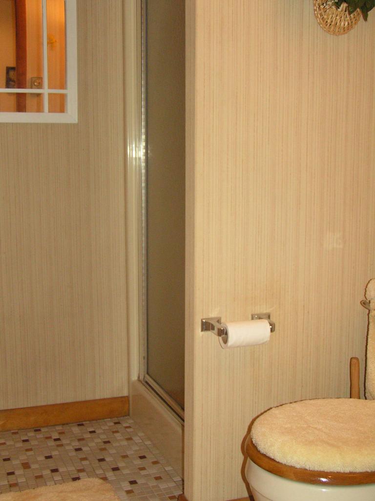1038-15 Decker Road Arcadia, LA 71001 - Photo 17 of 19 a bathroom with a toilet and a shower