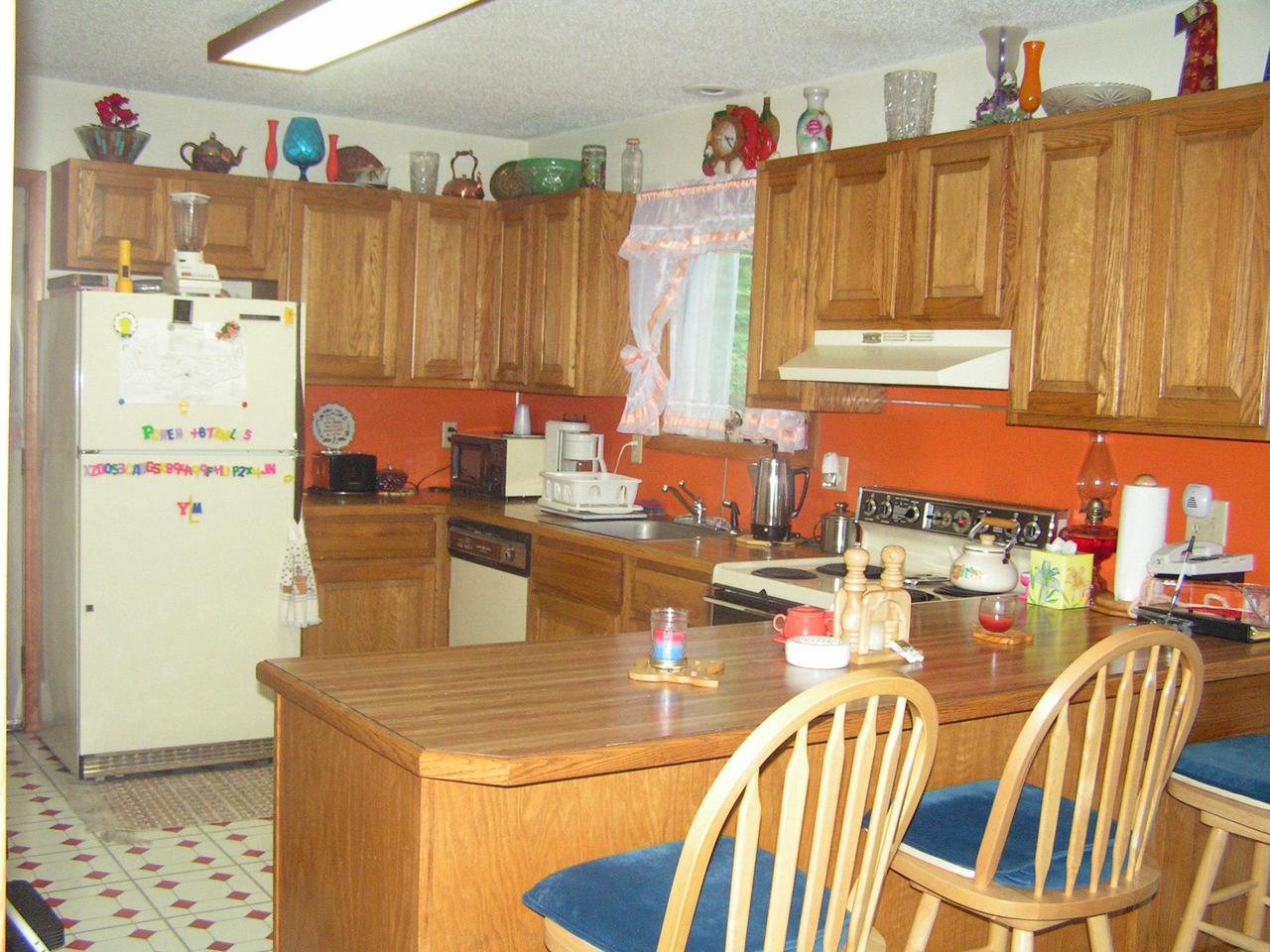 1038-15 Decker Road Arcadia, LA 71001 - Photo 7 of 19 a dining table with chairs and a refrigerator