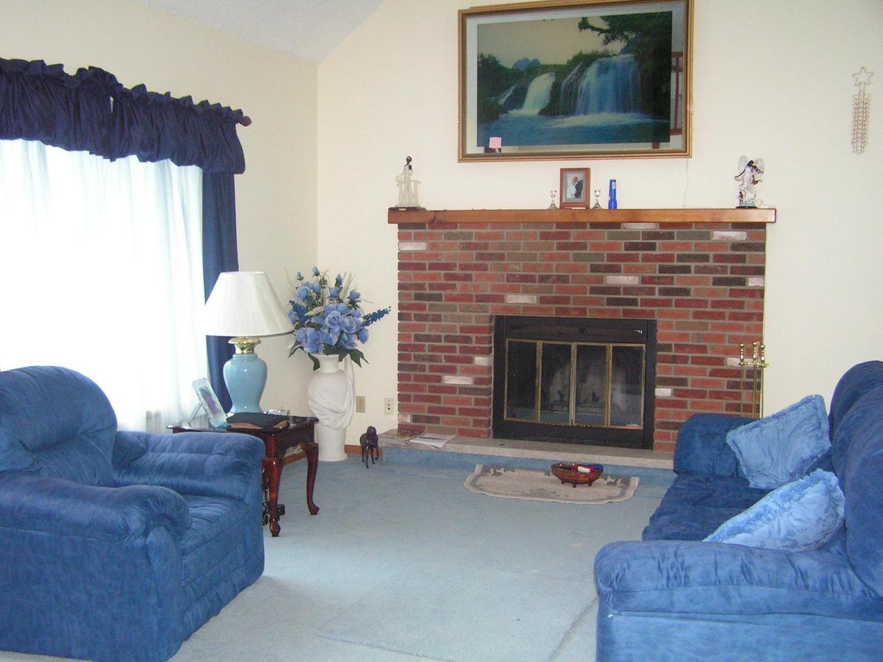 1038-15 Decker Road Arcadia, LA 71001 - Photo 9 of 19 a living room with furniture and a fireplace