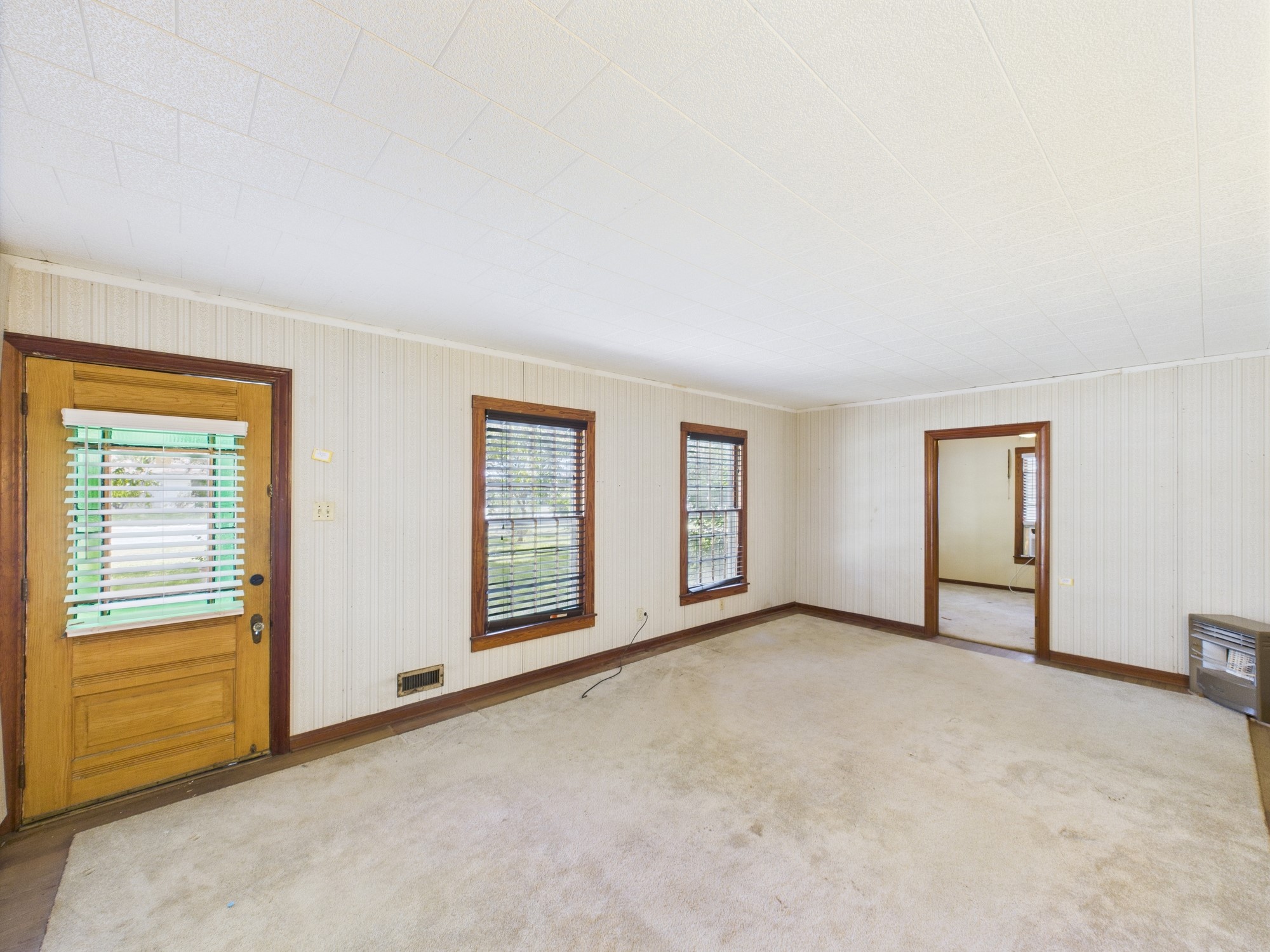 305 West Converse Street Weimar, TX 78962 - Photo 11 of 30 an empty room with windows