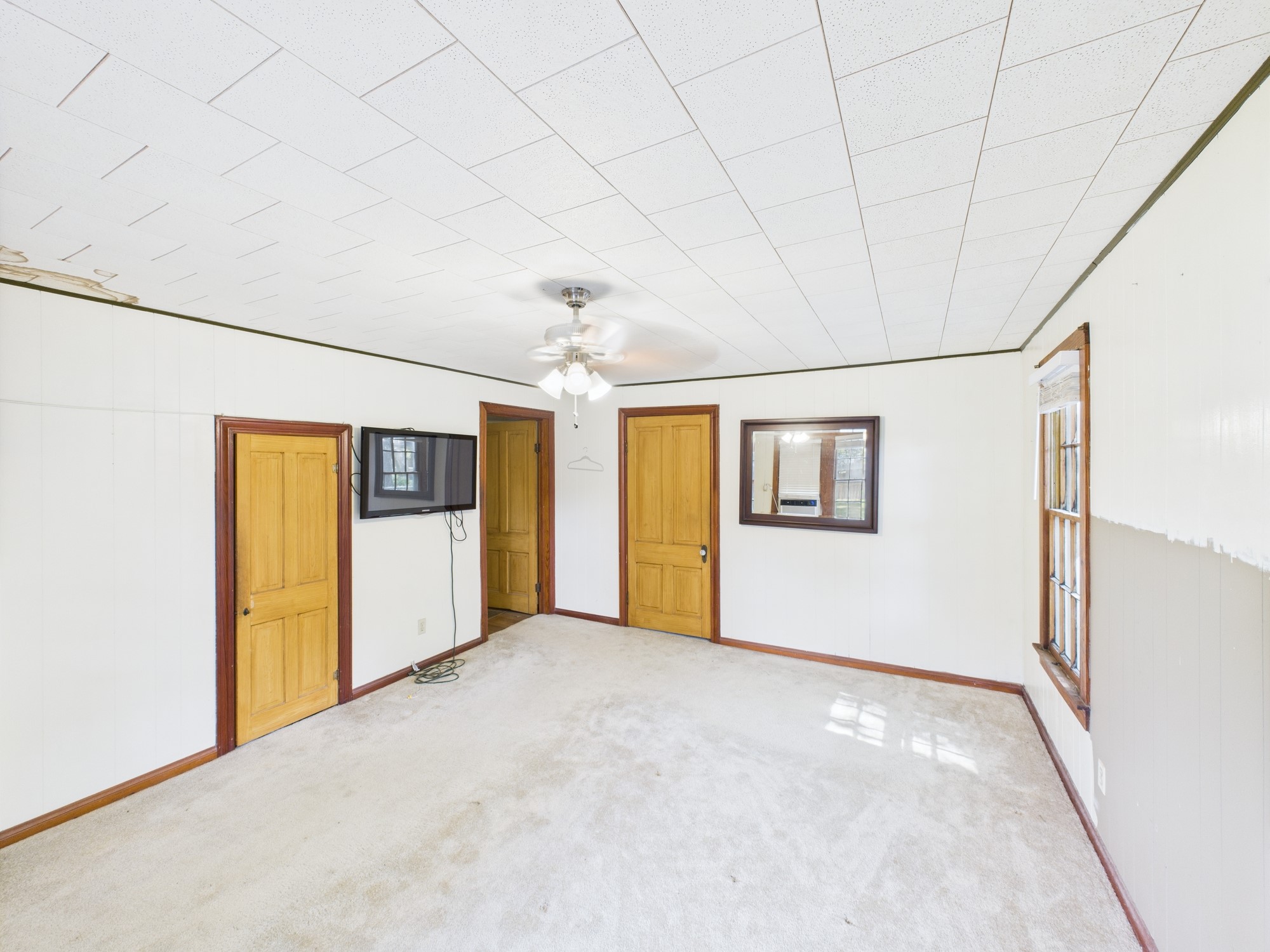 305 West Converse Street Weimar, TX 78962 - Photo 12 of 30 an empty room with windows
