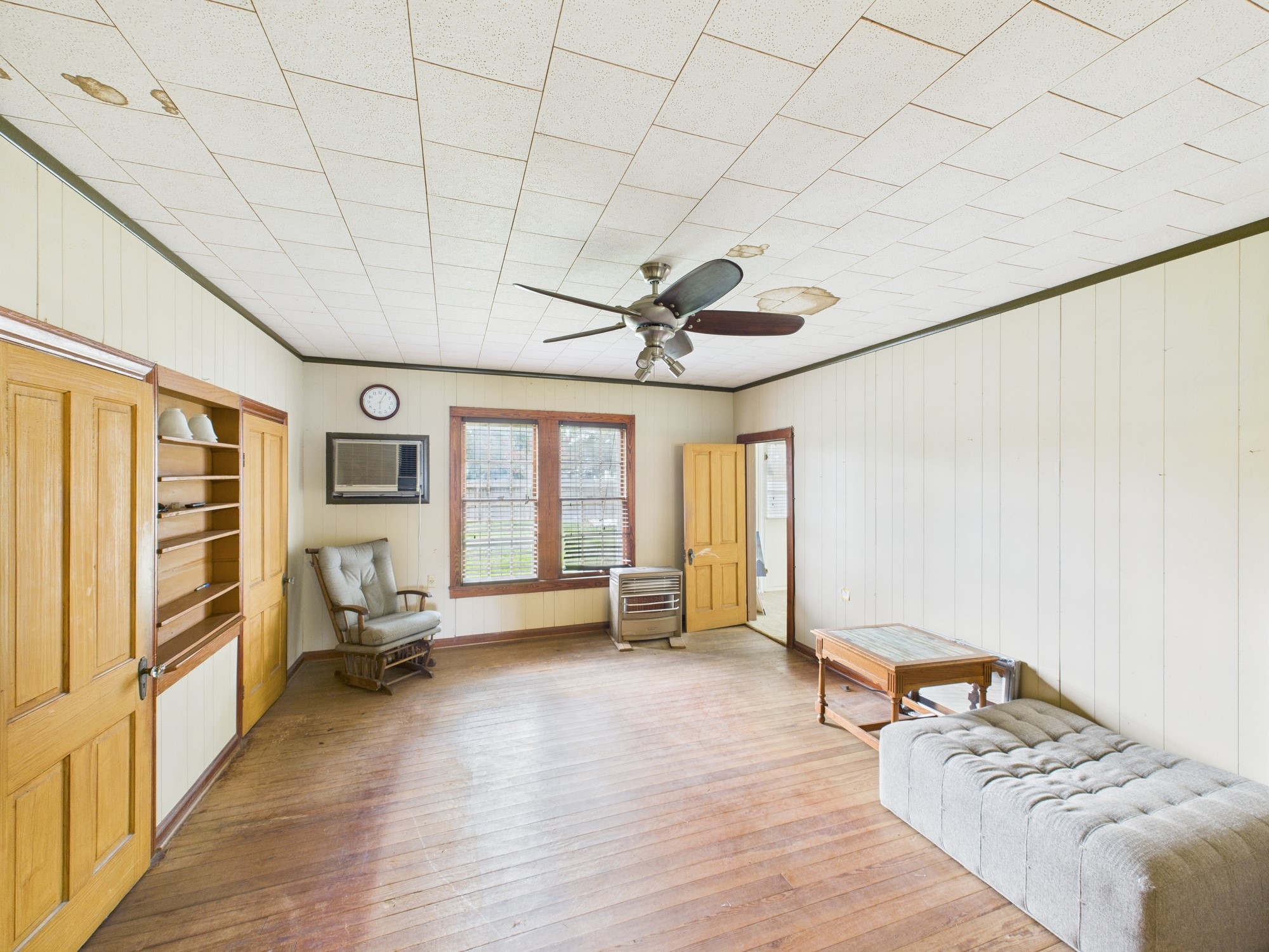305 West Converse Street Weimar, TX 78962 - Photo 23 of 30 a bedroom with furniture and a large window