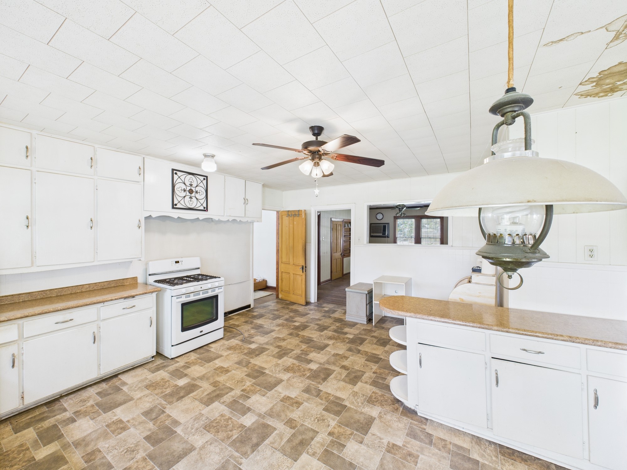 305 West Converse Street Weimar, TX 78962 - Photo 25 of 30 a kitchen with stainless steel appliances granite countertop a sink and cabinets