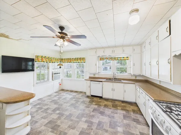 a view of an empty room with windows