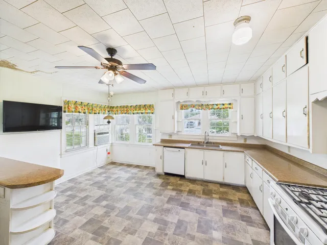 a view of an empty room with a large window