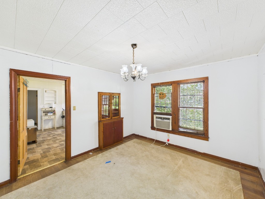 305 West Converse Street Weimar, TX 78962 - Photo 6 of 30 wooden floor in an empty room with a window