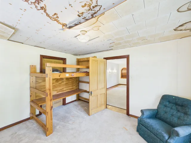 a view of a livingroom with furniture and a ceiling fan