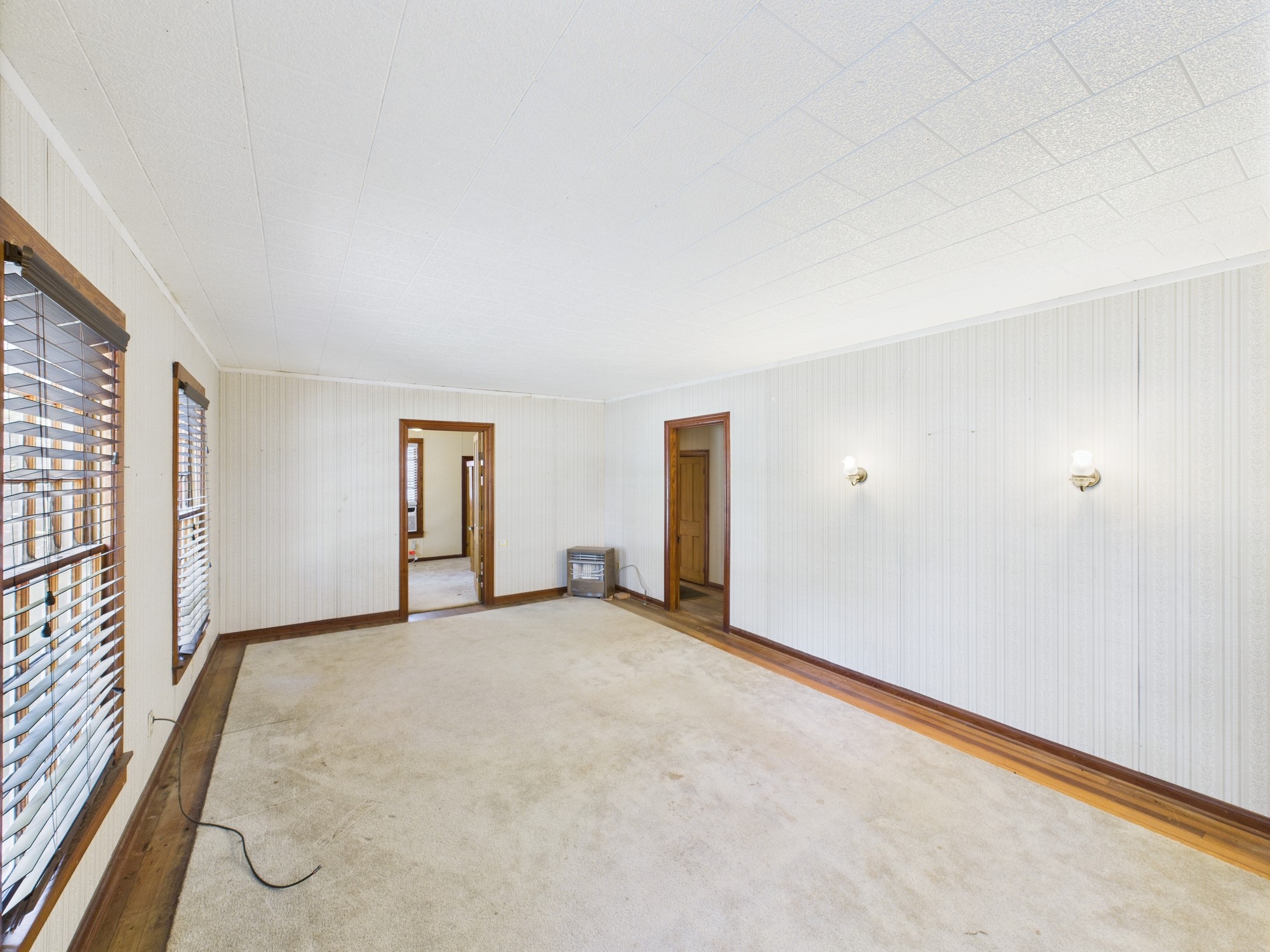 305 West Converse Street Weimar, TX 78962 - Photo 10 of 30 an empty room with windows