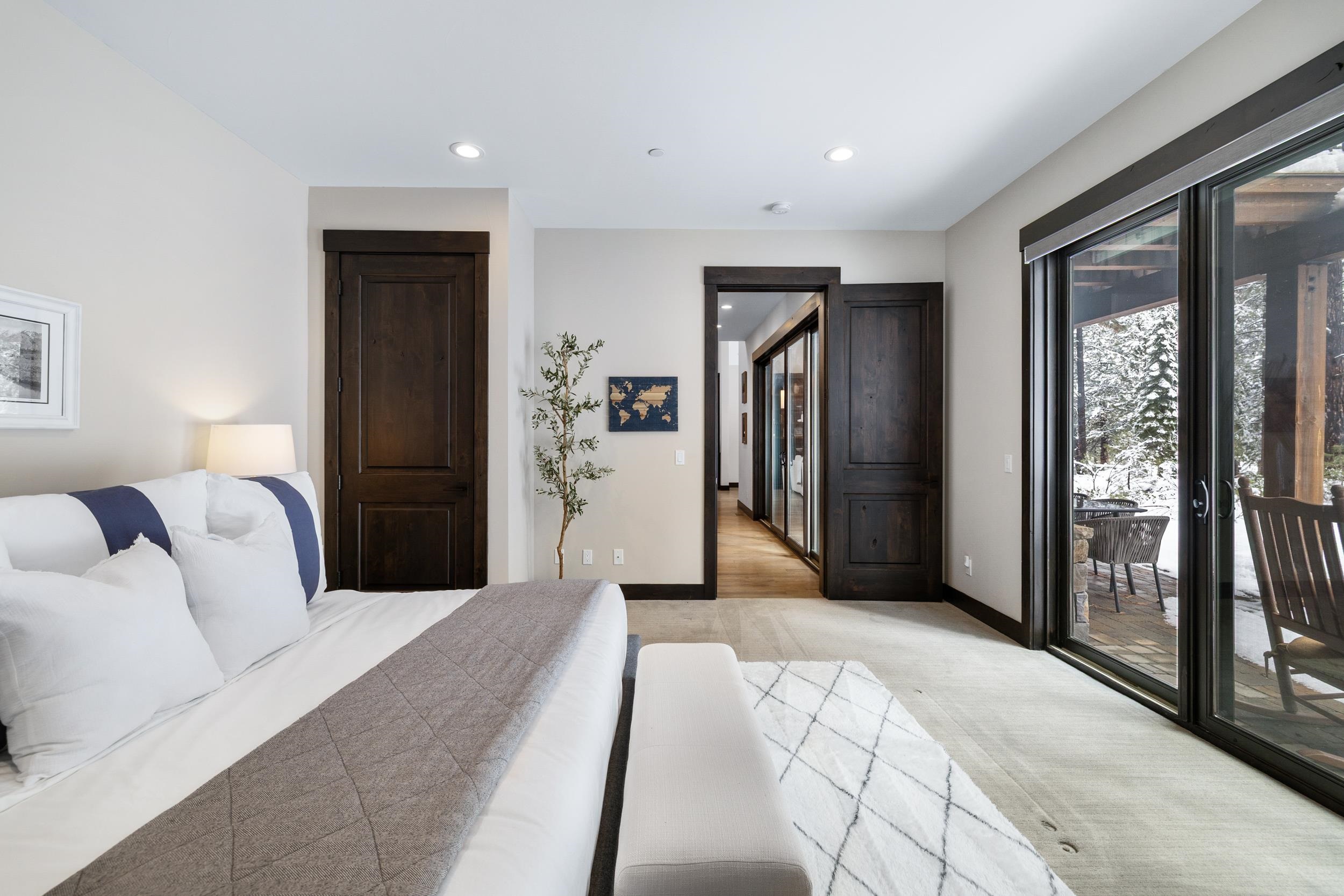 10601 Carson Range Road Truckee, CA 96161 - Photo 17 of 28 a bedroom with a large bed and a large window