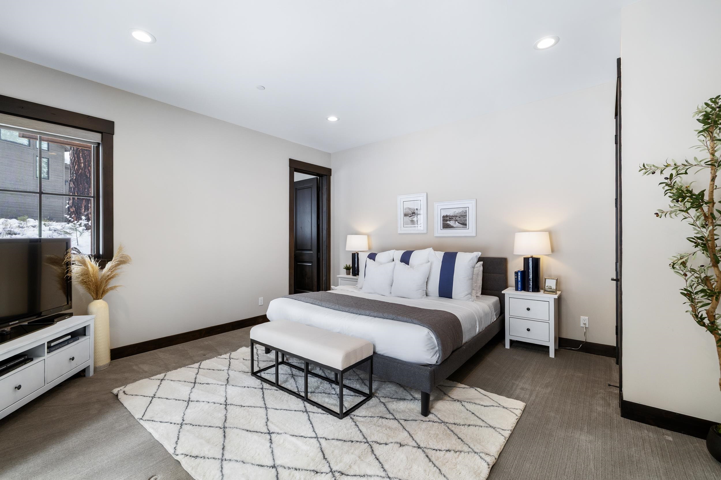 10601 Carson Range Road Truckee, CA 96161 - Photo 19 of 28 a bed room with a bed and a television